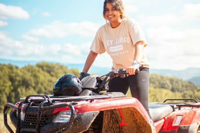 A rider on a quad bike at the top of a hill